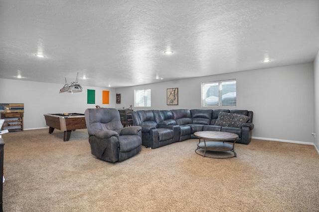 living area featuring light carpet, baseboards, a textured ceiling, and pool table