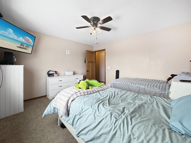 bedroom featuring ceiling fan, carpet, and baseboards