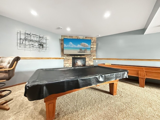 game room with pool table, light colored carpet, a stone fireplace, and recessed lighting