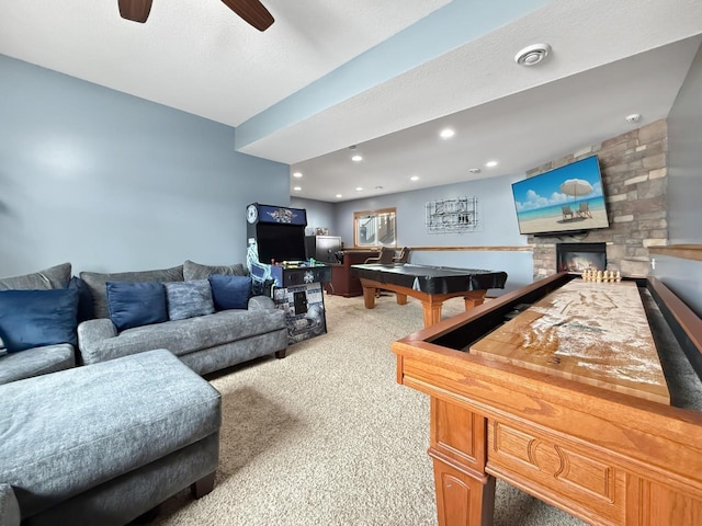 game room featuring light colored carpet, ceiling fan, pool table, a stone fireplace, and recessed lighting