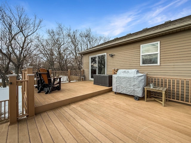 wooden deck featuring grilling area