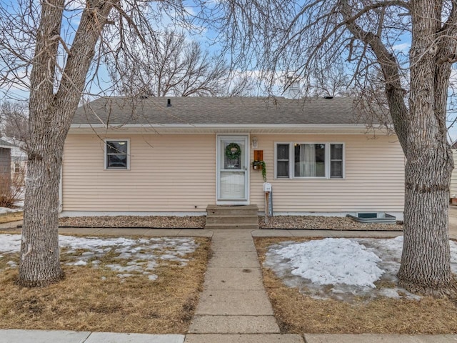 view of front of home featuring a shingled roof