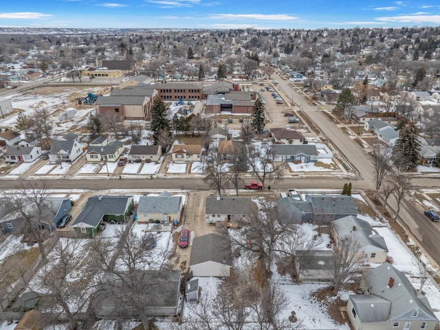 snowy aerial view featuring a residential view