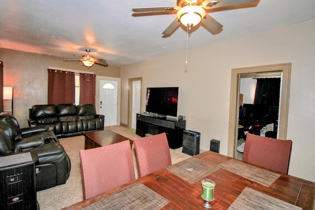 living area featuring a ceiling fan