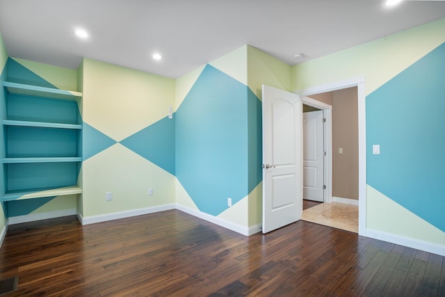 interior space featuring hardwood / wood-style flooring, baseboards, and recessed lighting