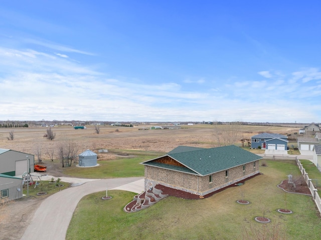 birds eye view of property featuring a rural view