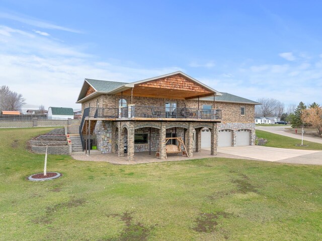 view of front of home with a front lawn, driveway, stairway, and an attached garage