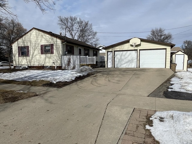 ranch-style home with an outbuilding and a detached garage