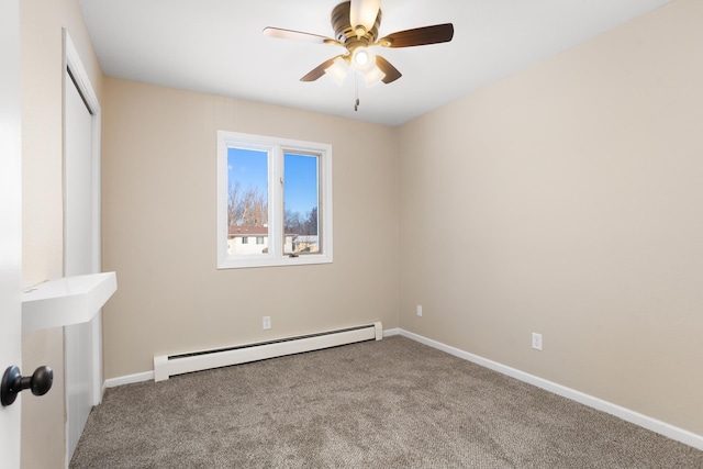 unfurnished bedroom with a baseboard heating unit, carpet, a closet, and baseboards