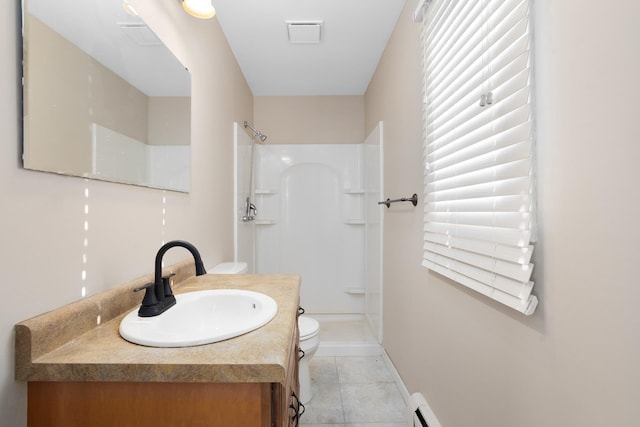 bathroom with vanity, tile patterned flooring, walk in shower, and toilet