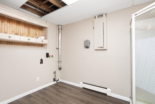 laundry area with electric panel, baseboards, baseboard heating, and dark wood-style flooring