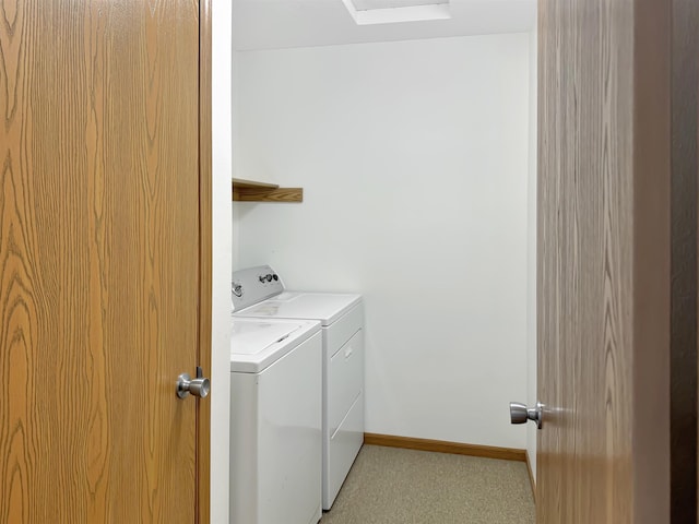 laundry room featuring baseboards, laundry area, and washer and clothes dryer