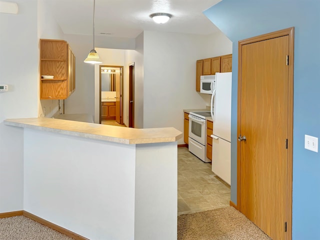 kitchen featuring white appliances, light colored carpet, a peninsula, and light countertops