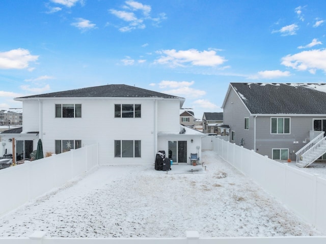 back of house featuring a fenced backyard