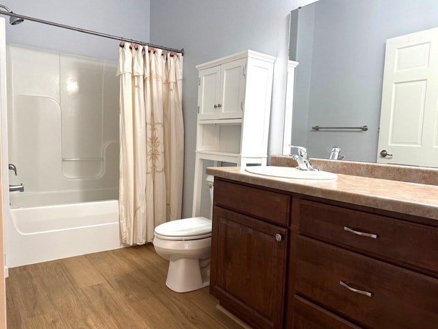 full bathroom with shower / bathtub combination with curtain, toilet, vanity, and wood finished floors