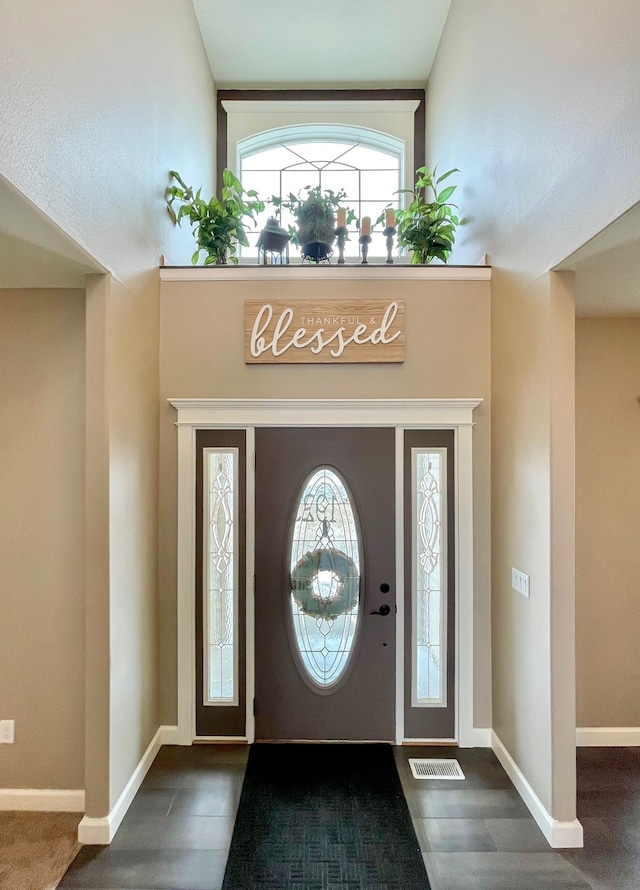 entrance foyer featuring visible vents and baseboards