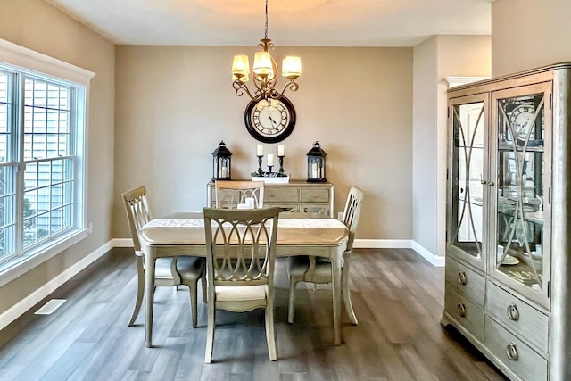 dining space with baseboards, visible vents, and a wealth of natural light