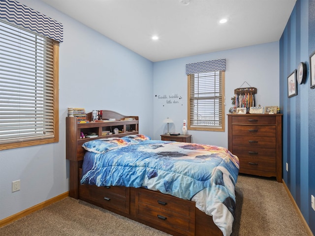 carpeted bedroom featuring recessed lighting and baseboards