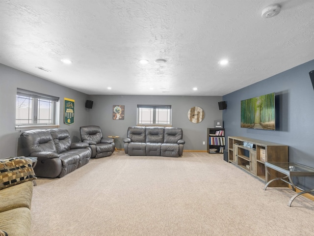 living room with recessed lighting, visible vents, plenty of natural light, and carpet floors