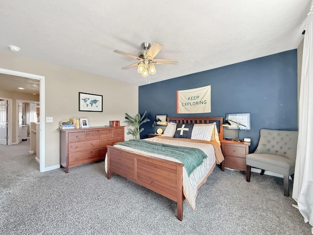 carpeted bedroom with a ceiling fan and baseboards