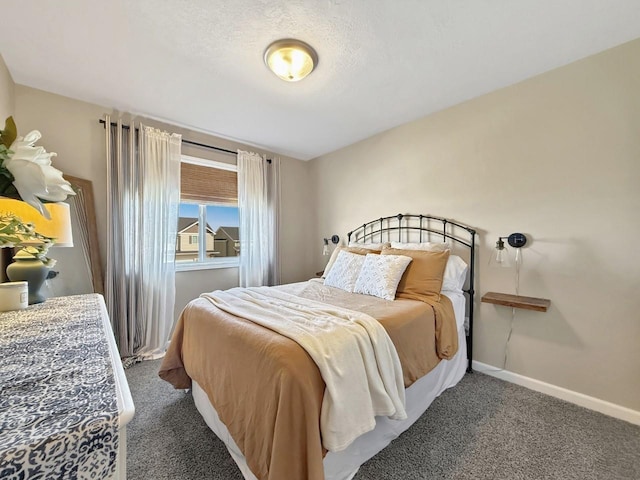 bedroom featuring baseboards and carpet floors