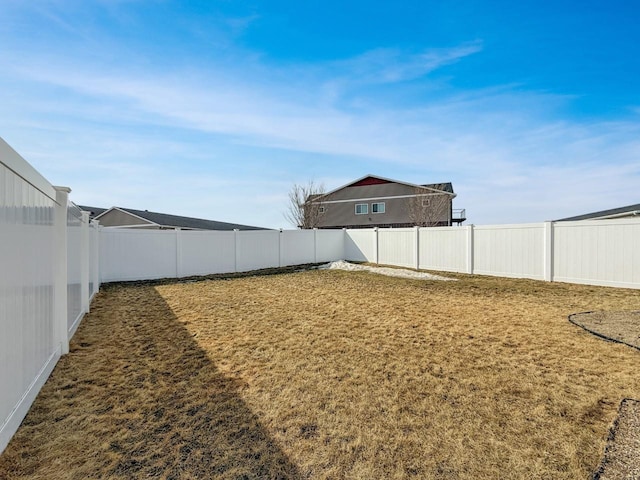 view of yard with a fenced backyard