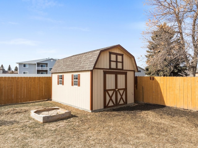 view of shed featuring a fenced backyard