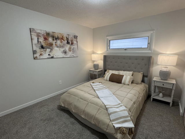 carpeted bedroom featuring baseboards and a textured ceiling