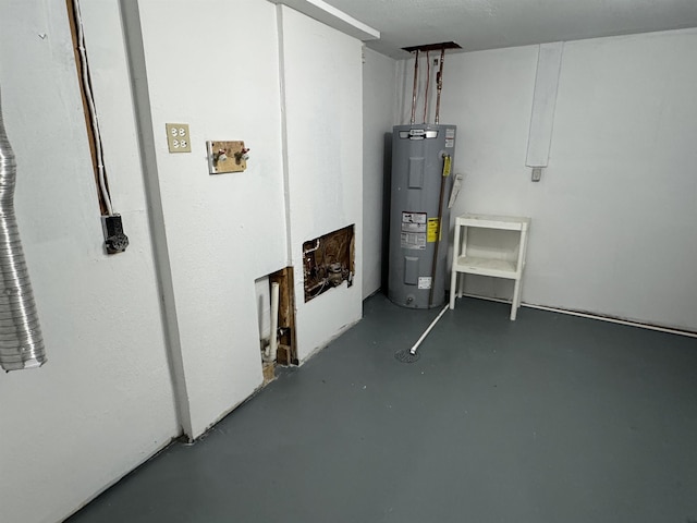 utility room featuring water heater