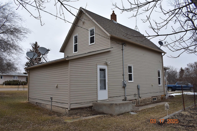 7 3rd St, Garrison, ND 58540 - view of side of home with a chimney and a shingled roof