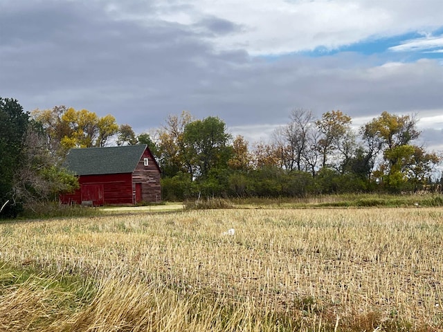 view of yard with an outdoor structure and a barn