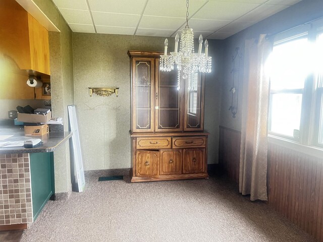 bathroom with an inviting chandelier and a paneled ceiling