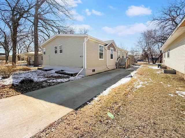 view of side of property with crawl space