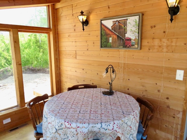 178 Twin Oaks Dr, Bottineau, ND 58318 - dining room with wooden walls and visible vents