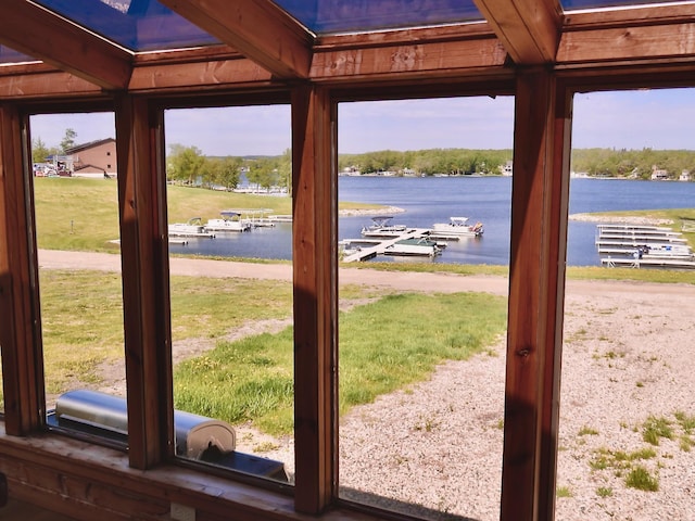 178 Twin Oaks Dr, Bottineau, ND 58318 - doorway to outside featuring a water view