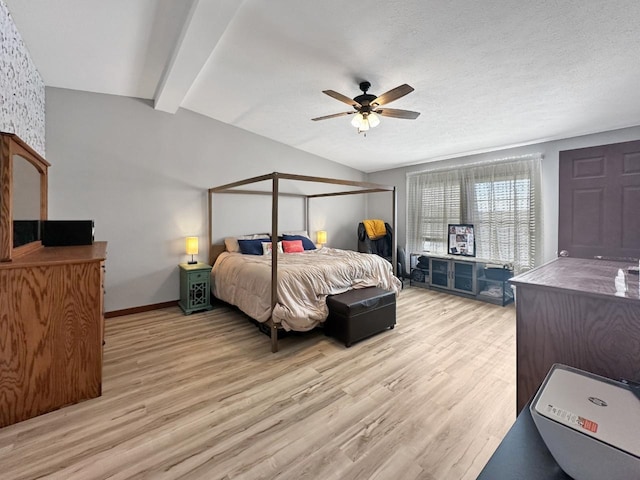 12780 153rd St, Sawyer, ND 58781 - bedroom featuring light wood-style flooring, ceiling fan, lofted ceiling with beams, and baseboards