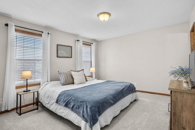 bedroom with carpet flooring and baseboards