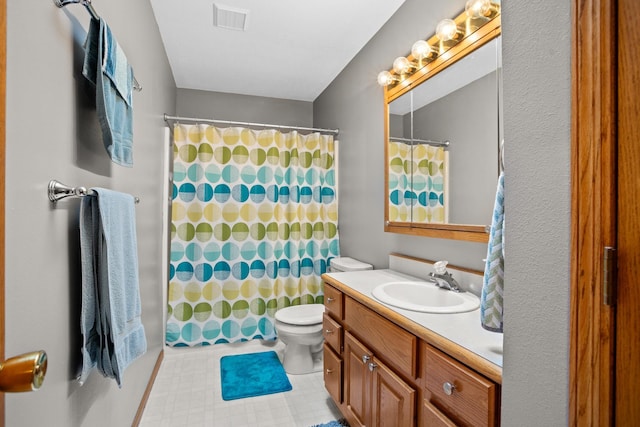 1419 17 1/2 Ave, Minot, ND 58701 - full bath with toilet, vanity, visible vents, and a shower with curtain