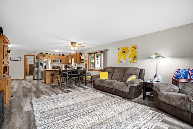 1419 17 1/2 Ave, Minot, ND 58701 - living area featuring a ceiling fan and wood finished floors