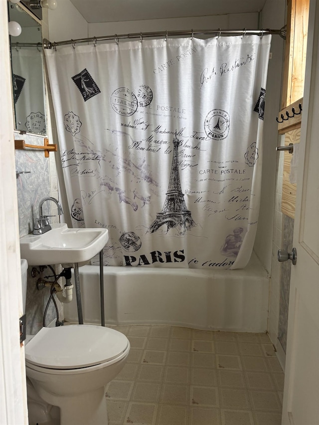 bathroom featuring shower / bath combo, toilet, tile patterned floors, and a sink