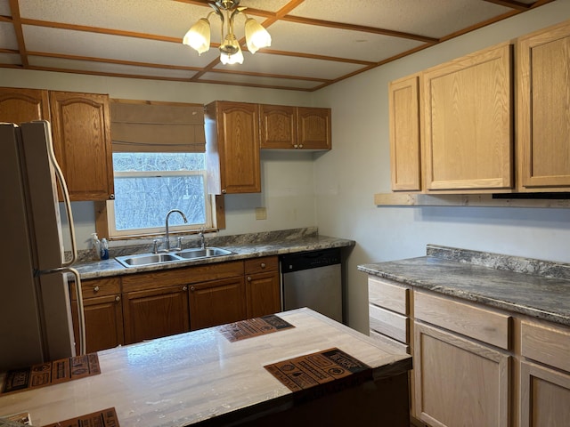 kitchen featuring dishwasher, freestanding refrigerator, a sink, and a ceiling fan