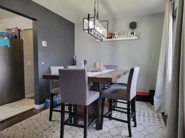 1425 9th St, Minot, ND 58701 - dining space featuring baseboards
