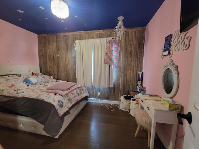 1425 9th St, Minot, ND 58701 - bedroom with wood finished floors and wood walls