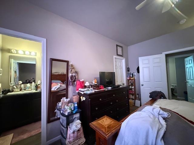 38 Mulberry Loop, Minot, ND 58703 - bedroom with connected bathroom, ceiling fan, and wood finished floors