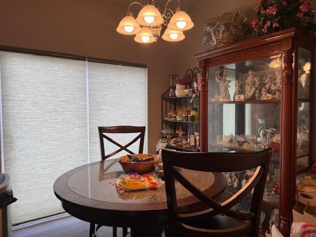 38 Mulberry Loop, Minot, ND 58703 - dining space with a notable chandelier