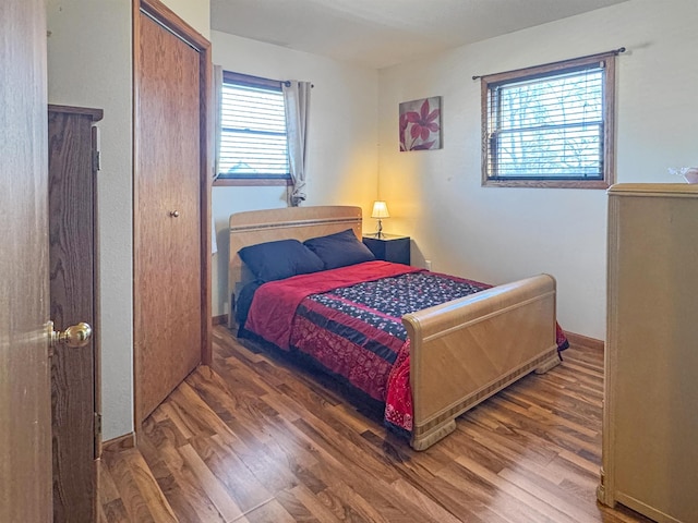 812 15 1/2 Ave SE, Minot, ND 58701 - bedroom with wood finished floors and a closet