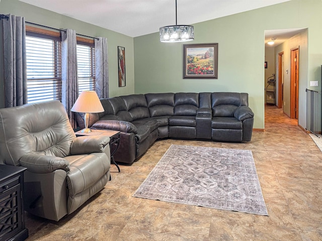 812 15 1/2 Ave SE, Minot, ND 58701 - living area featuring lofted ceiling and a chandelier
