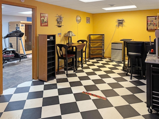 812 15 1/2 Ave SE, Minot, ND 58701 - dining space with tile patterned floors and a drop ceiling
