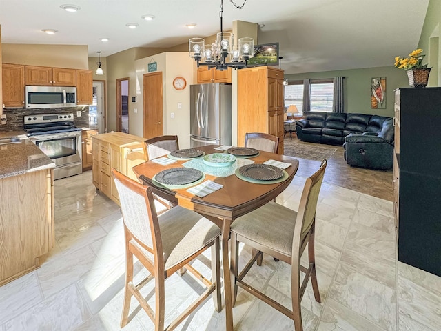 812 15 1/2 Ave SE, Minot, ND 58701 - dining area featuring marble finish floor and a chandelier