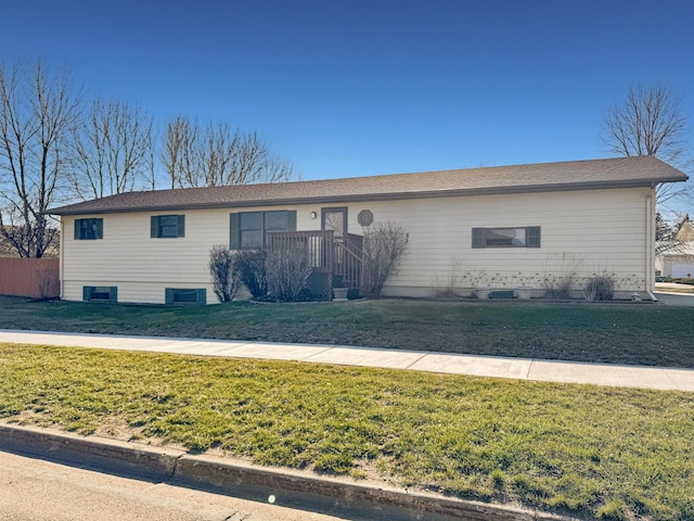 812 15 1/2 Ave SE, Minot, ND 58701 - ranch-style house with a front yard